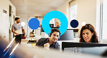 Two people using a laptop in Randstad office