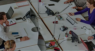 Picture of a customer meeting with women and men at one table