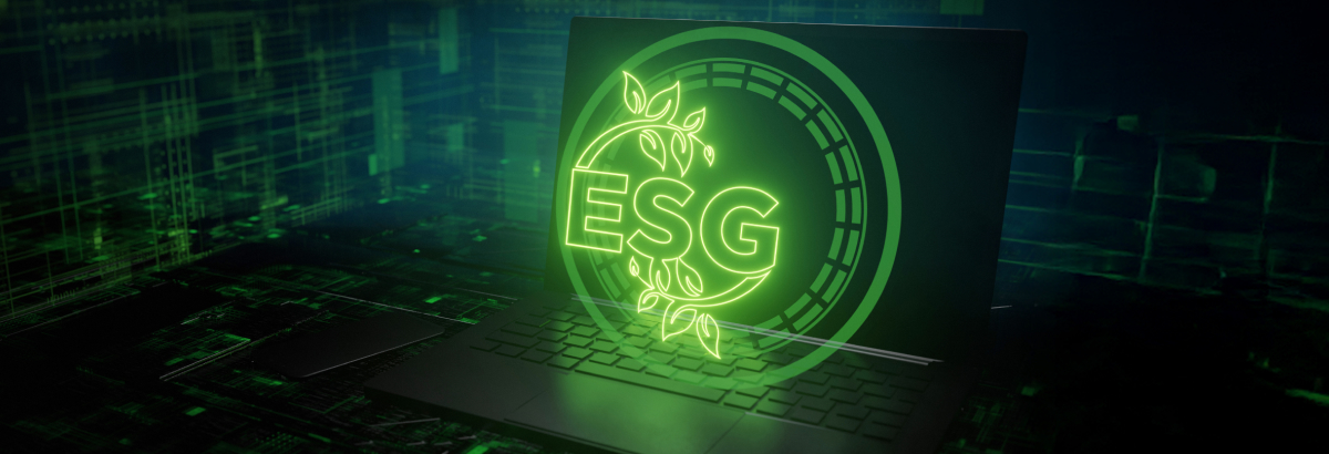 An open laptop with the letters “ESG” glowing in green inside a circle above it